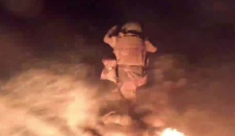 Surviving occupiers jump from boat into water after being hit by drone. VIDEO