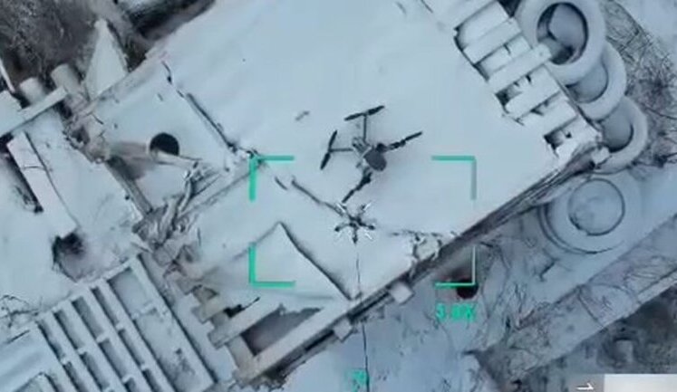 Aerial reconnaissance men captured enemy UAV using drone, hook, and rope. VIDEO