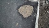 Около "Донбасс Арена" коммунальщики закатали люки в асфальт. ФОТОрепортаж