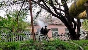 Rescuers extinguish fire at an educational facility after Russian shelling in Sumy region. PHOTO