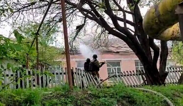Rescuers extinguish fire at an educational facility after Russian shelling in Sumy region. PHOTO