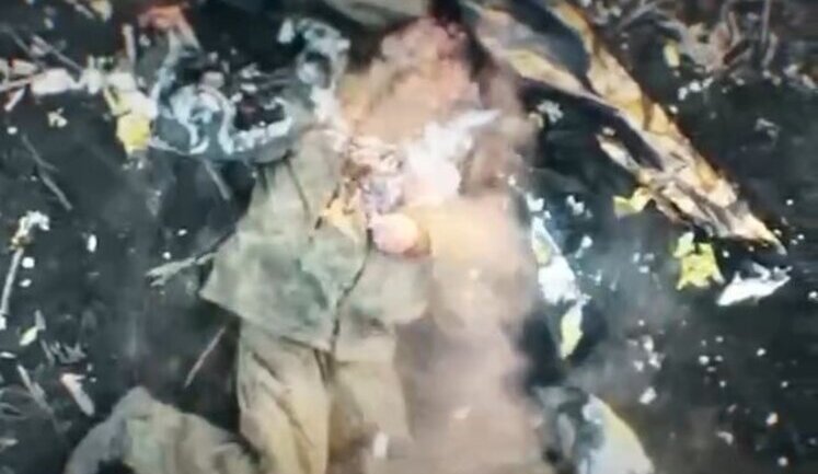 Drone operator eliminates occupier crawling across field with two payload drops, while he was hiding under "invisibility cloak". VIDEO 18+
