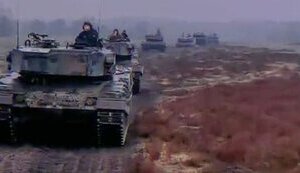 Column of Leopard 2A4 tanks moves along field road in Ukraine. VIDEO