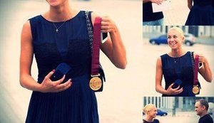 Buyer returned medal to world champion Natalia Hodunko, who sold it to help army. PHOTOS