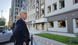 Healey near the damaged British Council building in Kyiv