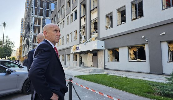 Healey near the damaged British Council building in Kyiv