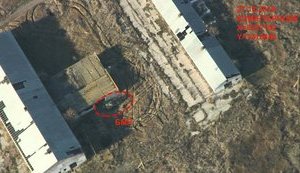 Замаскированные БМП, следы от гусениц, боевики на блокпостах, - штаб АТО обнародовал снимки оккупированного Коминтерново. ФОТОрепортаж