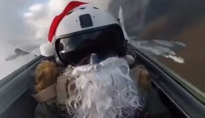 Ukrainian plane pilot with white beard and Santa Claus hat launching Christmas "gifts" to occupiers. VIDEO