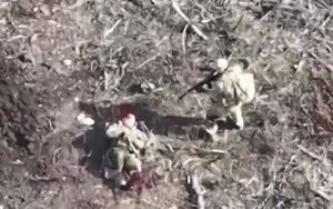 Russian finishes off his wounded accomplice on battlefield