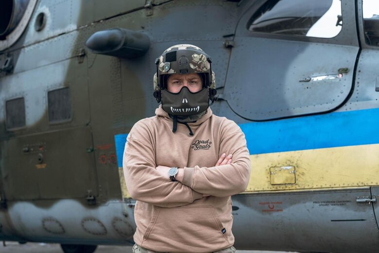 Pilot Maksym Chaika near a helicopter