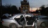 Под Львовом водитель &amp;quot;Мерседеса&amp;quot; выскочил на ж/д переезд - поезд-кран протянул машину 100 метров... ФОТОрепортаж.
