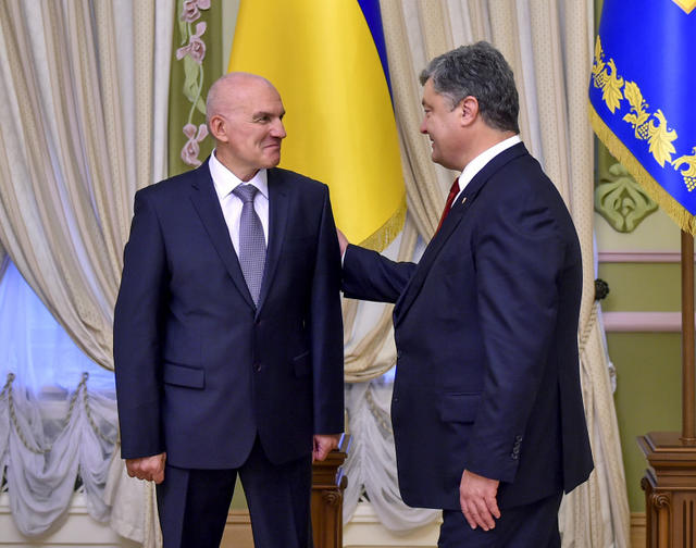посол