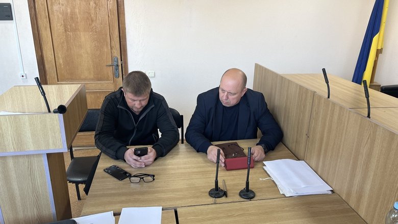 Military TCK officer Serhiy Volovyk with his lawyer