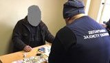 Під час одержання 1500 дол. хабара на Закарпатті затримано чиновника облспоживспілки, - прокуратура. ФОТОрепортаж