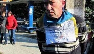 Terrorists Tied a Man with Ukrainian Flag to a Pole in Zuhres. PHOTO