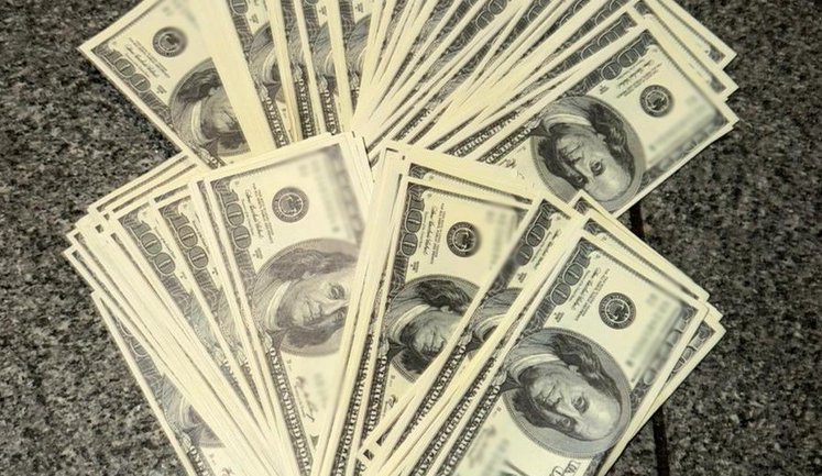 У Києві Нацполіція затримала двох чоловіків, які вимагали у дружини мобілізованого $20 тис. за звільнення з ТЦК. ФОТОрепортаж