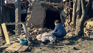 Mother sits beside body of her son, who was killed in Russian strike in Kremenchuk. VIDEO&PHOTOS