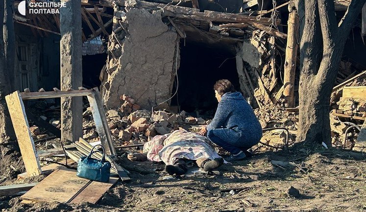 Mother sits beside body of her son, who was killed in Russian strike in Kremenchuk. VIDEO&PHOTOS