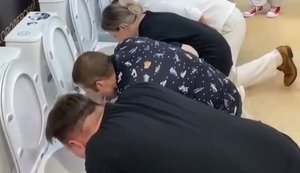 Eight Russians drink sweet water from toilet bowls. VIDEO