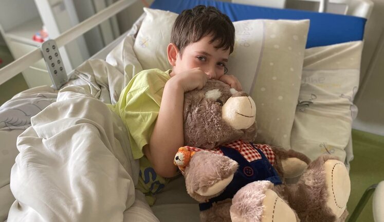 Boy's mother died in his arms, and he was taken to occupied Donetsk. Story of 10-year-old Illia from Mariupol. PHOTOS