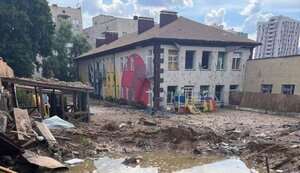 Pit from enemy missile hitting playground near kindergarten in Kyiv. PHOTO