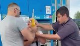 A scuffle between locals in the queue for fuel