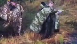 Devout occupier in anti-drone cloak emerges from copse with accomplice, crosses himself, points way, and moment later both are killed by drone strike. VIDEO