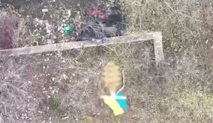 Combat drone destroys occupier wrapped in black polyethylene film. VIDEO