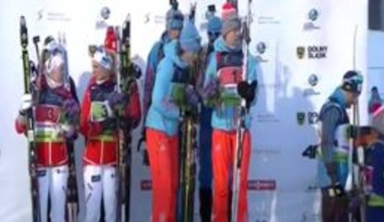 Ukrainian biathletes step down podium as Russian anthem starts playing. VIDEO