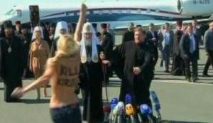 Femen Activist Attacked Patriarch Kirill: I Exorcise Thee!. VIDEO