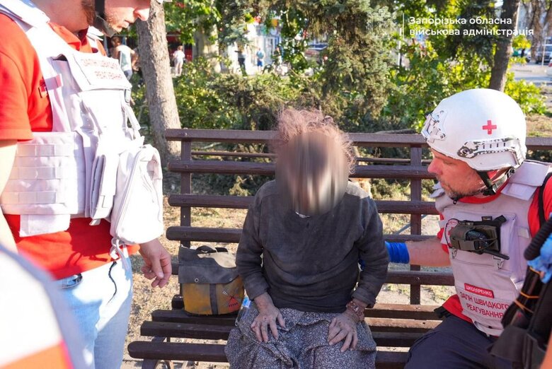 Rescuers help victims of the strike on Zaporizhzhia