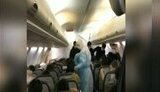 Люди в масках и спецкостюмах: в сети появилось видео из салона самолета с эвакуированными из Китая украинцами. ВИДЕО+ФОТО