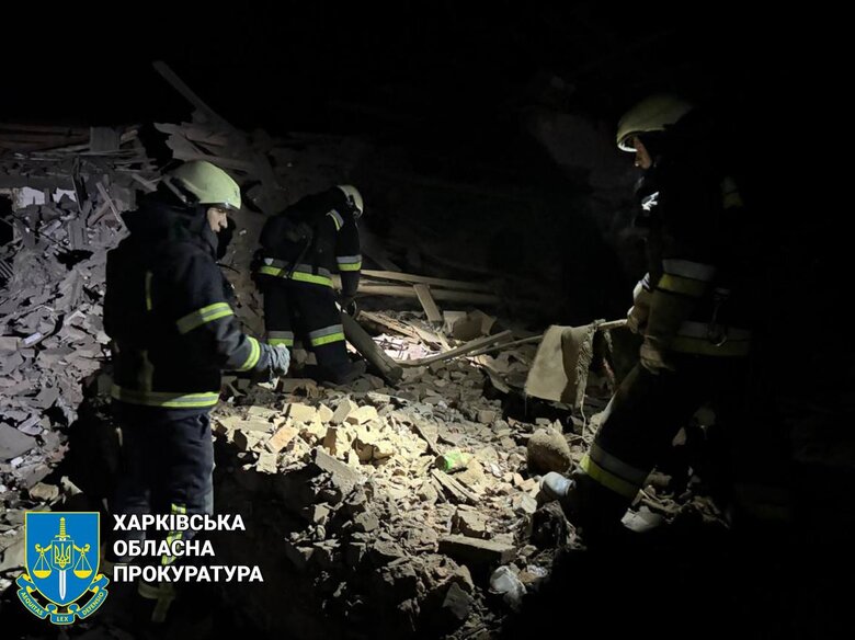Rescuers at the site of a Russian air strike