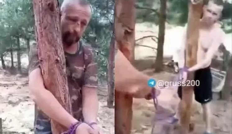 Росіяни прив’язали до дерева двох "відмовників": "Вообще п#здец. Жопа какая полосатая. Отшлепали?". ВIДЕО