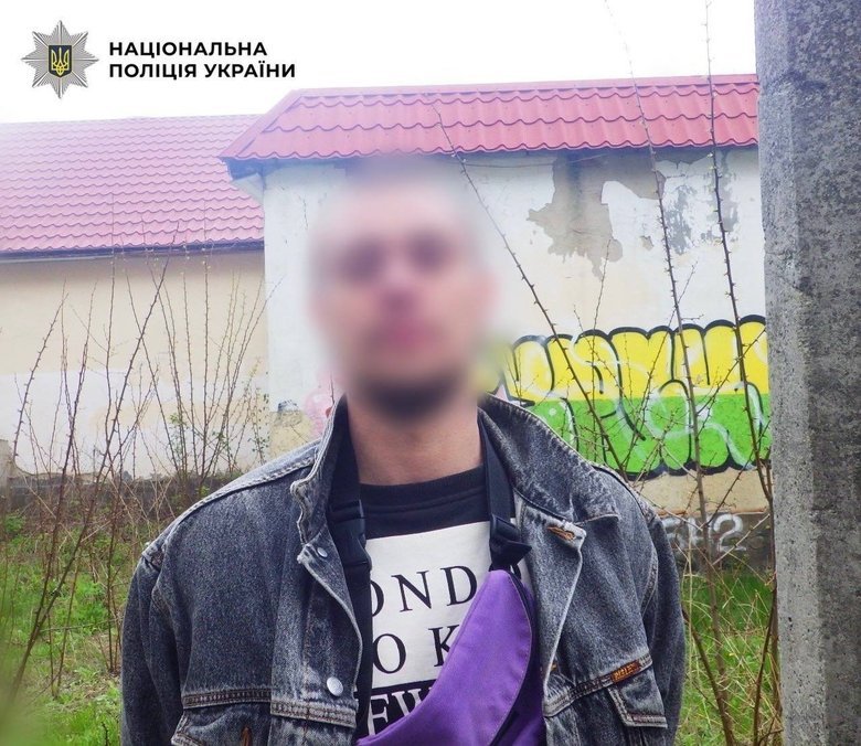 Man walking around Kyiv with a pistol