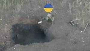 Occupiers were flushed out of their underground burrows: two fighters from 5th Assault Brigade throw explosives into enemy positions. VIDEO