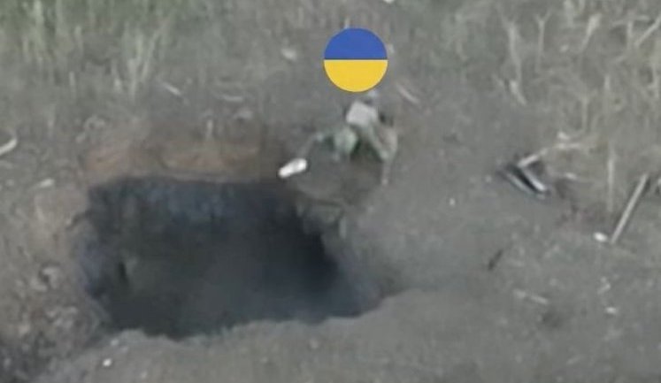 Occupiers were flushed out of their underground burrows: two fighters from 5th Assault Brigade throw explosives into enemy positions. VIDEO