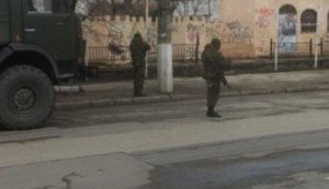 Armed people in cars on duty at military units in the cities of Simferopol and Saky. PHOTO