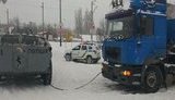 Через сильний снігопад у Києві задіяли БТР, на в