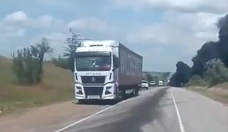 Russian truck driver on traffic through "land corridor" to Crimea: "It’s burning behind us, they f#cking hit it. It’s burning ahead too, they f#cking hit it. More are incoming, f#ck". VIDEO