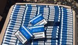 Поблизу лінії розмежування на Донеччині правоохоронці виявили схрон із сигаретами та спиртом. ФОТОрепортаж