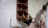 flag of Ukraine on ruins in Sumy