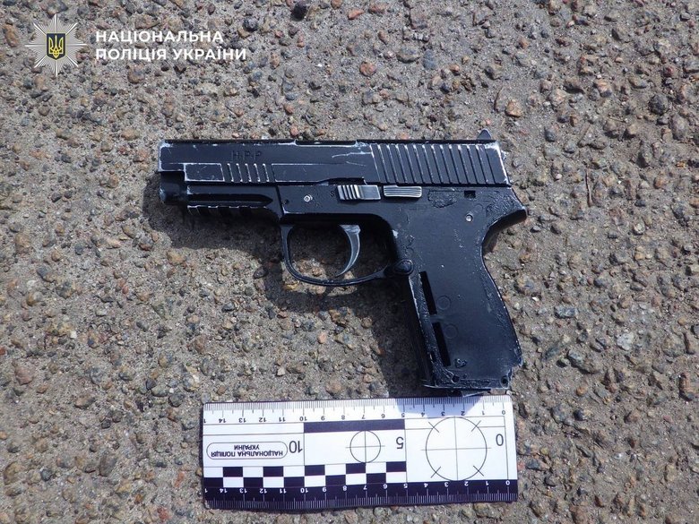 Man walking around Kyiv with a pistol