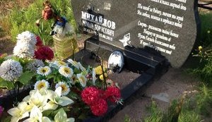 Russia's Defense Ministry puts up tombstones on graves of so-called "volunteers" killed in Donbas in 2014. PHOTOS