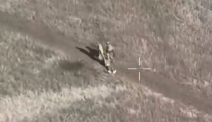 Two occupiers drag their "three hundredth" and then leave him to die on road. VIDEO