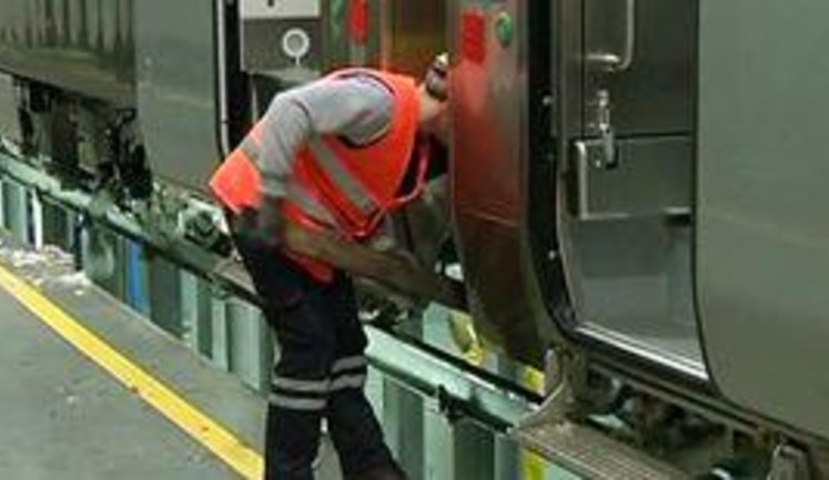 Ukrainian Railway Workers Service Modern Hyundai Trains by Wooden Sticks. VIDEO