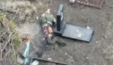 burnt Russian crawling through cemetery