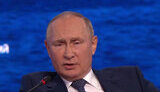 путін