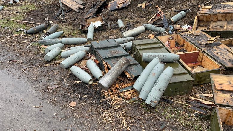 Andriivka after Russian occupation: Full tin with pile of ammunition 04