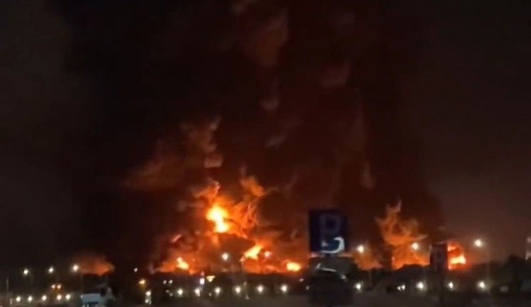 Russian man films nighttime drone attack on Wildberries warehouse in Krasnodar: "It’s flying, can you hear it? Those are missiles flying". VIDEO